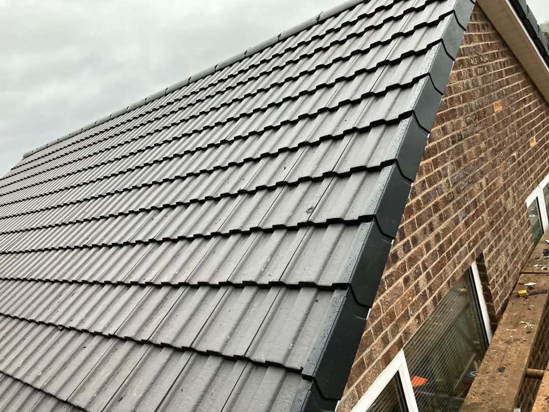 Newly finished slate roof on a British brick house in Worcestershire