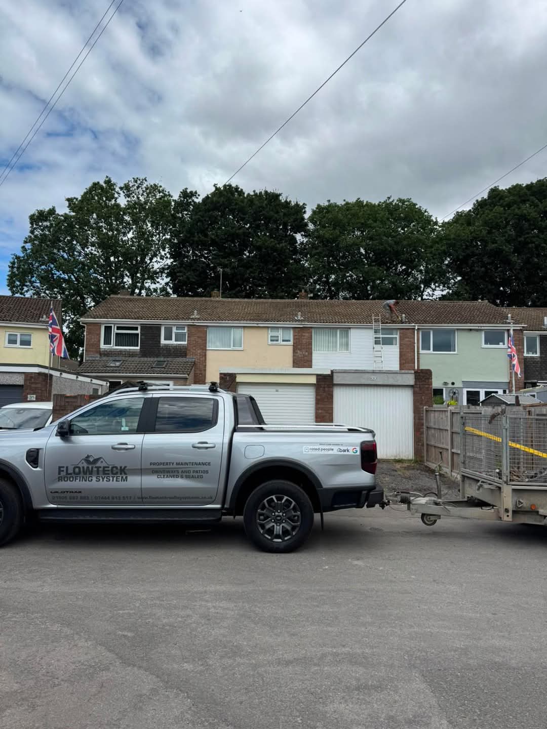 Flowteck pickup and trailer on a re-roofing job