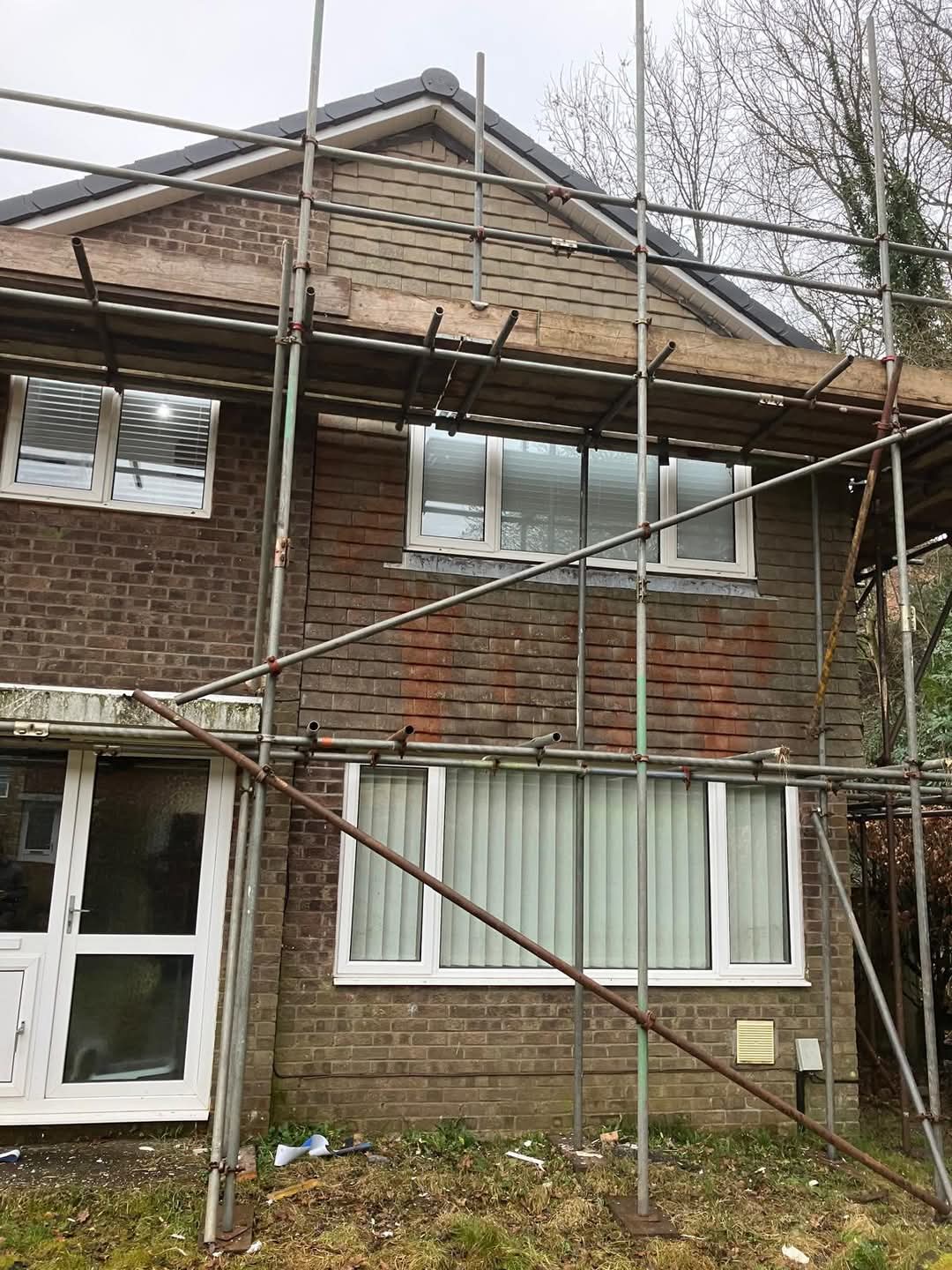 Scaffolding erected to a gable elevation with new roofline fitted